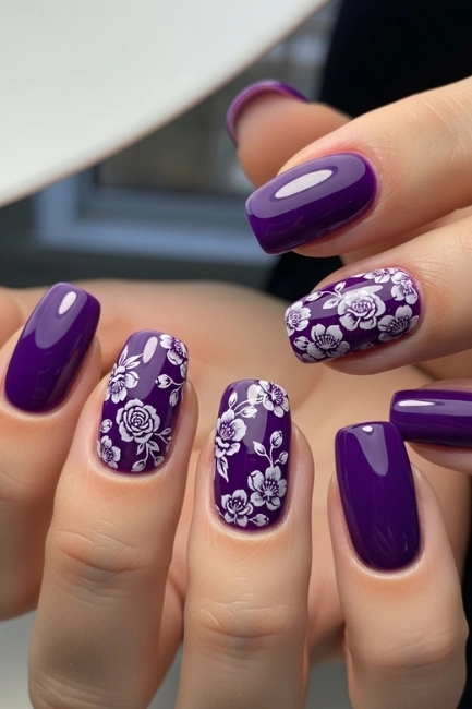Glossy Violet Nails with Delicate Flower Stamping