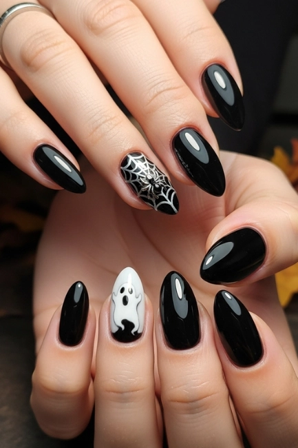 Classic Black Nails with Spooky Accents